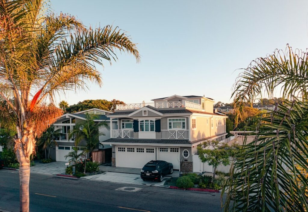 California home with palm trees representing a probate real estate sale in San Diego